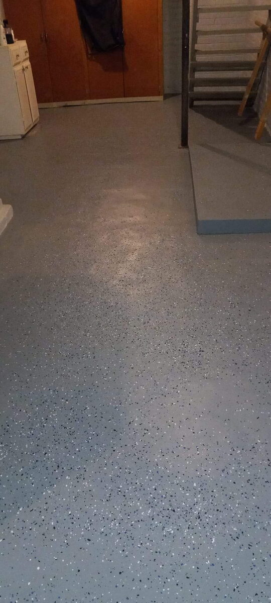 Concrete floor repaired and finished with decorative coating in Omaha