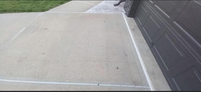 Driveway expansion joints cleaned and freshly caulked